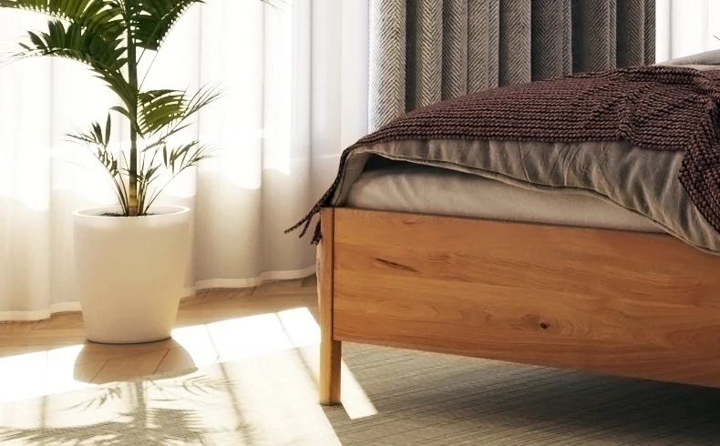 Drewniane łóżko z plecionym zagłówkiem